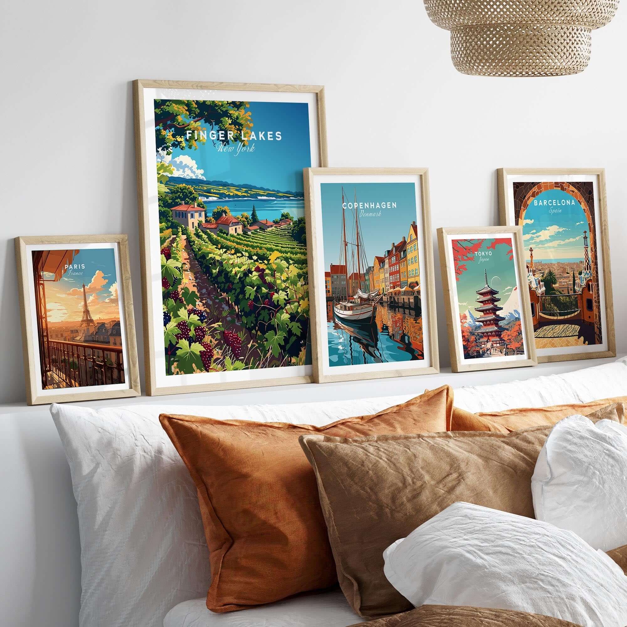 Finger Lakes Print - Wine Region displayed among framed artwork on a cozy bed with decorative cushions.