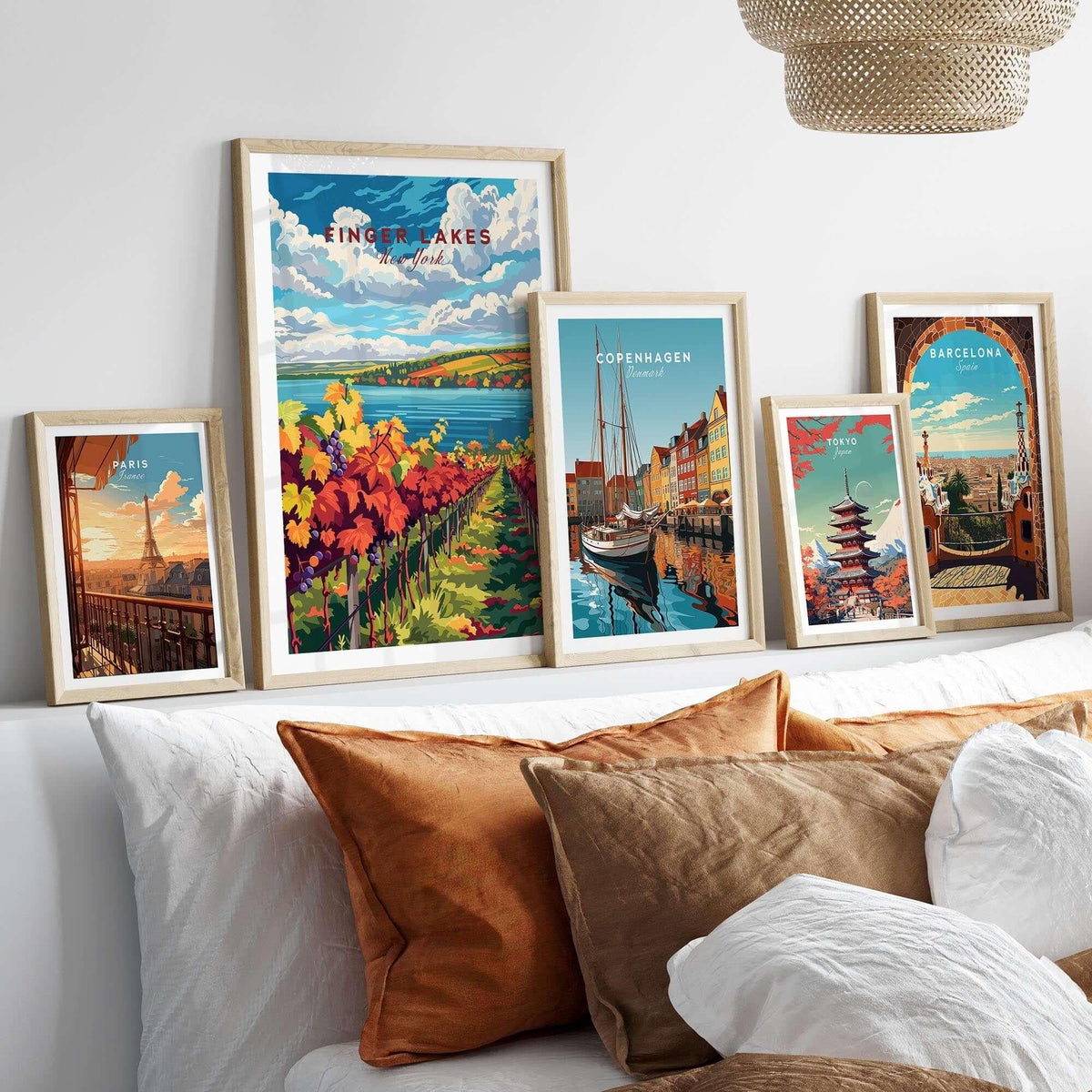 Showcasing the Finger Lakes Wine Region Poster among other travel posters on a stylish bed setup.