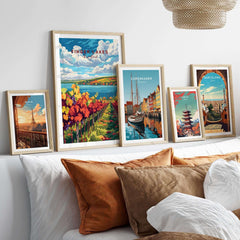 Showcasing the Finger Lakes Wine Region Poster among other travel posters on a stylish bed setup.