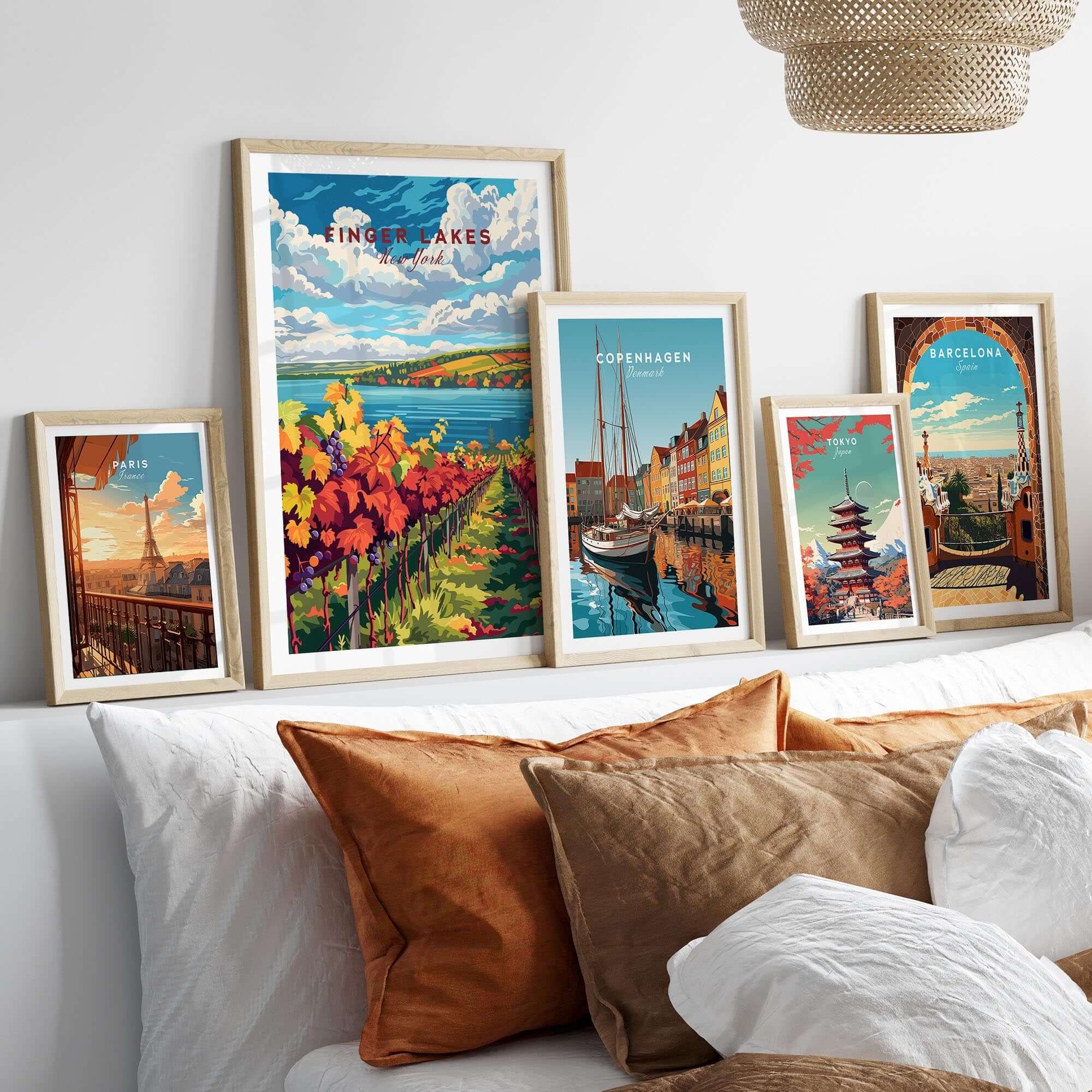 Showcasing the Finger Lakes Wine Region Poster among other travel posters on a stylish bed setup.