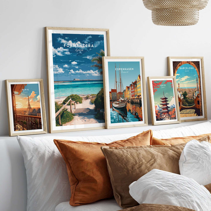 Formentera Blue Water Print | Balearic Island Home Decor displayed in stylish frames on a cozy bed with pillows.