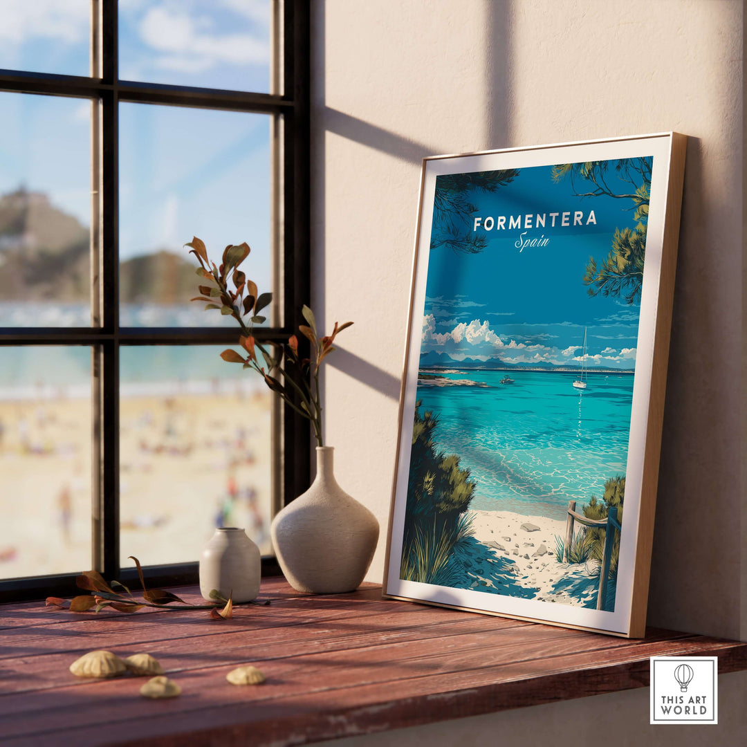 Formentera Balearic Clear Sea Landscape Print | Coastal Home Wall Art framed on a wooden table by a window.