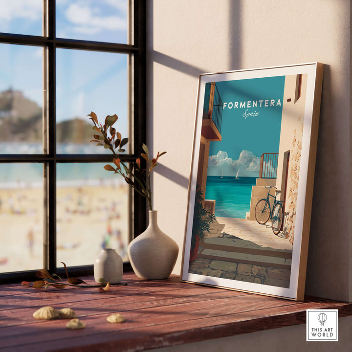Formentera Old Town Sea View Print | Mediterranean Holiday Wall Art displayed on a desk by a window.