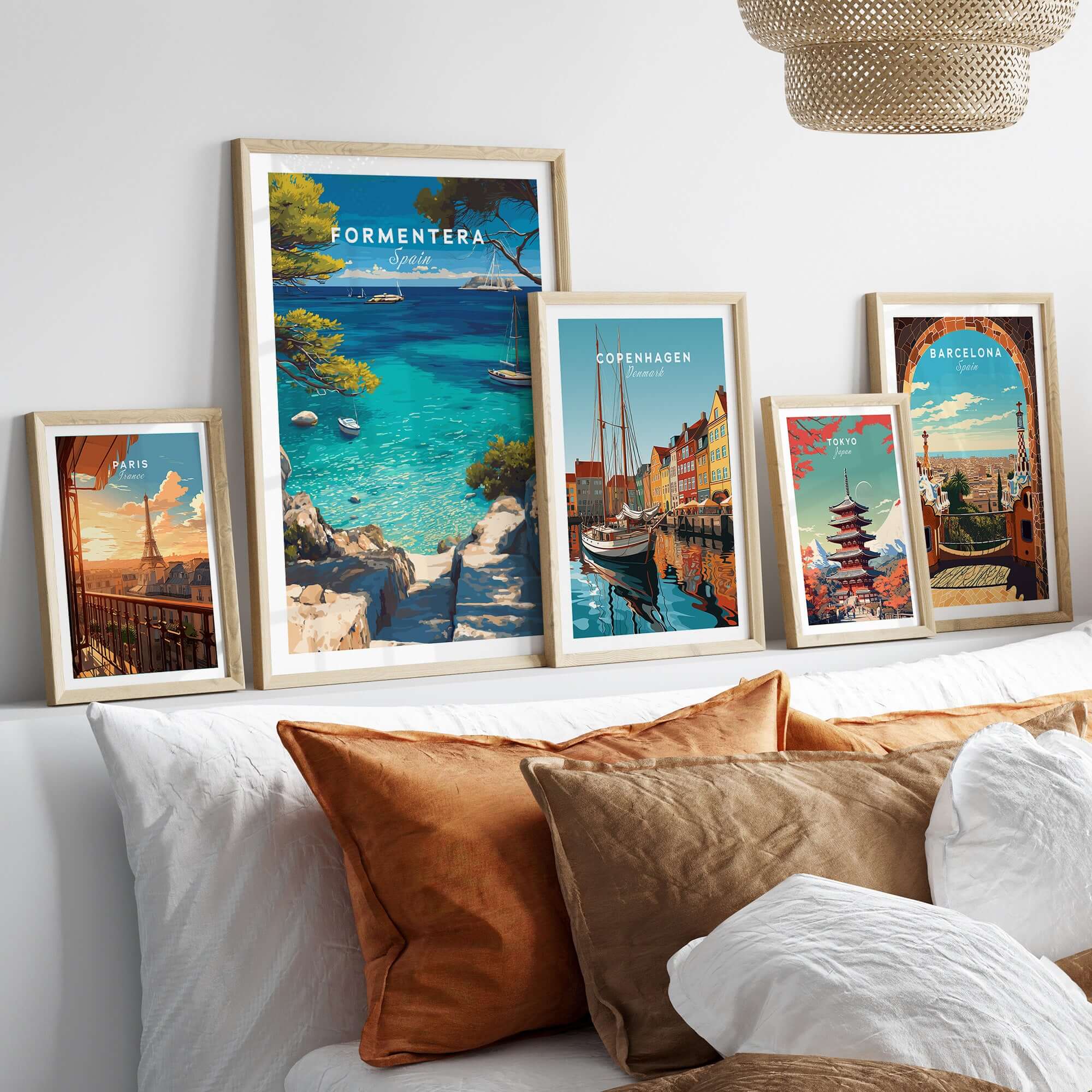 Formentera Poster - Balearic Print | Mediterranean Travel Wall Art displayed among other city prints on a cozy sofa.