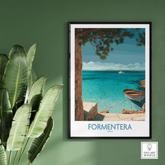 Formentera Spain Art Print | Beach Poster displayed on a green wall, featuring tranquil blue waters and a boat.