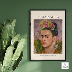 Frida Kahlo Self Portrait Dedicated Dr Eloesser Floral Poster Art Print displayed on a wall with green foliage.