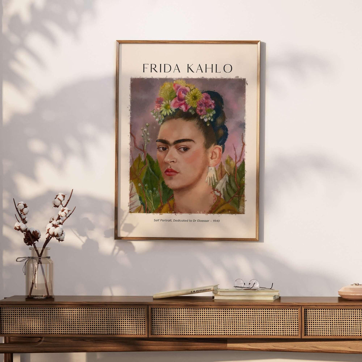 Frida Kahlo Self Portrait Dedicated Dr Eloesser Floral Poster Art Print displayed on a wall above a wooden console.