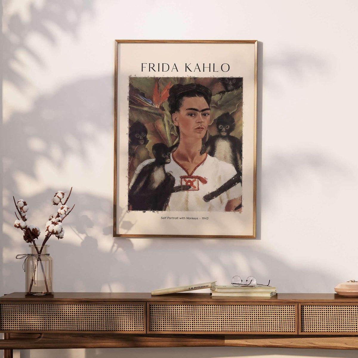 Frida Kahlo Self Portrait with Monkeys Famous Painting Poster Art Print displayed on a wall above a wooden console.