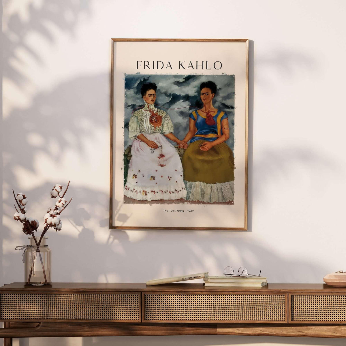 Frida Kahlo The Two Fridas Famous Art Print Poster Wall Art displayed on a wall above a wooden console table.