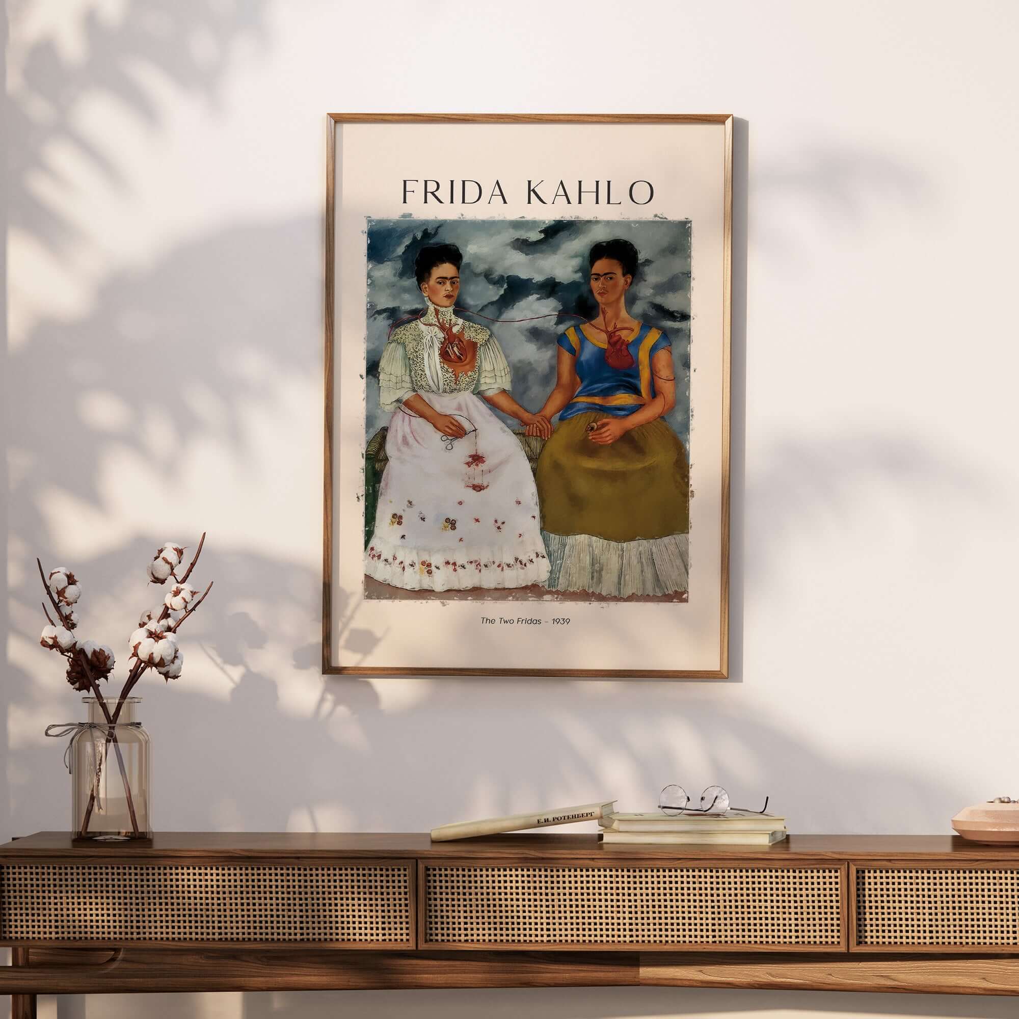 Frida Kahlo The Two Fridas Famous Art Print Poster Wall Art displayed on a wall above a wooden console table.