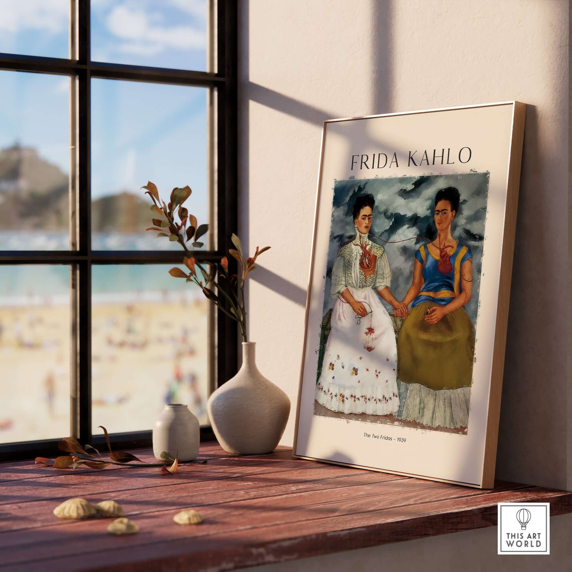 Frida Kahlo The Two Fridas Famous Art Print Poster Wall Art displayed in a bright room with a beach view.