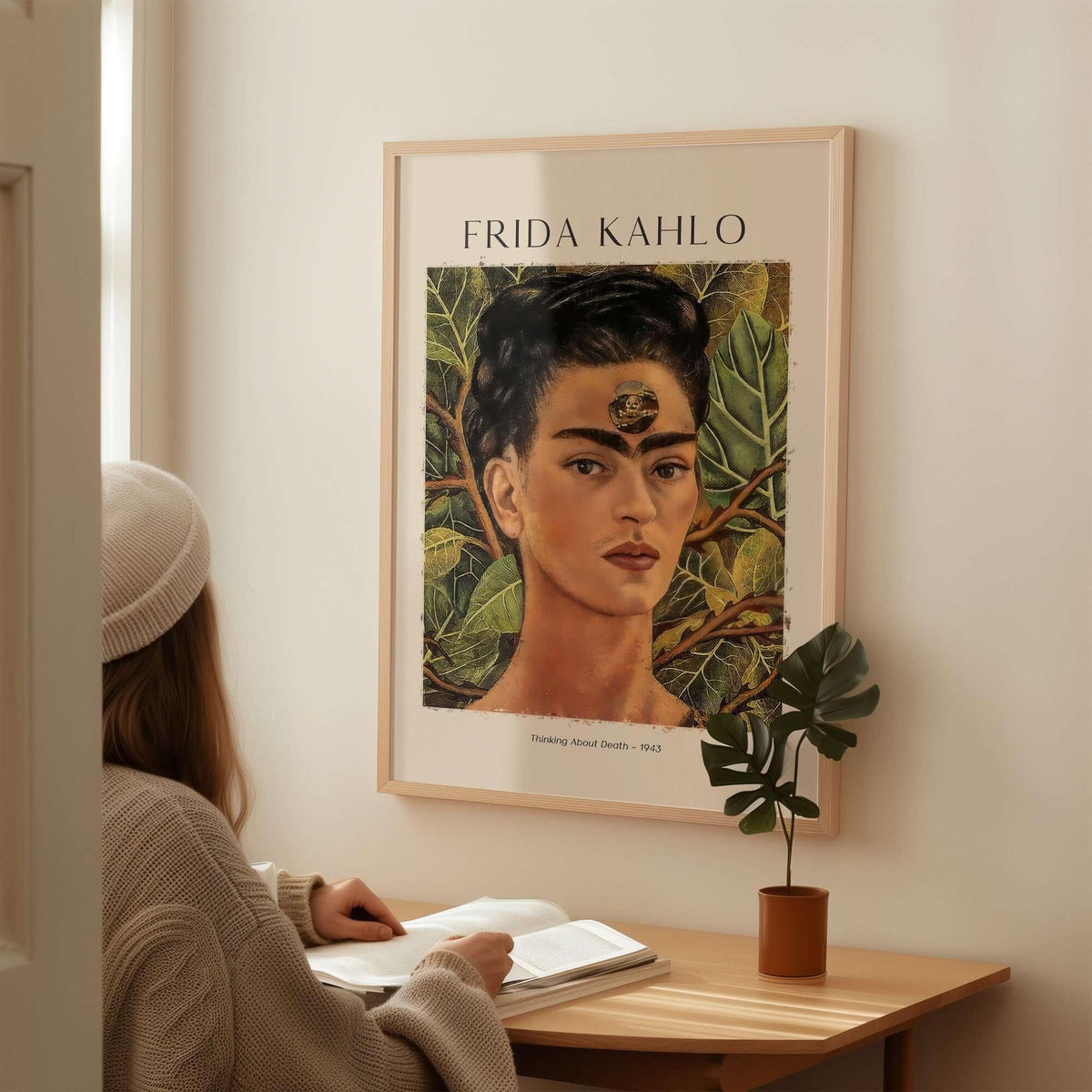 Frida Kahlo Thinking About Death Self Portrait Wall Art Print Poster displayed in a cozy setting with a person studying.