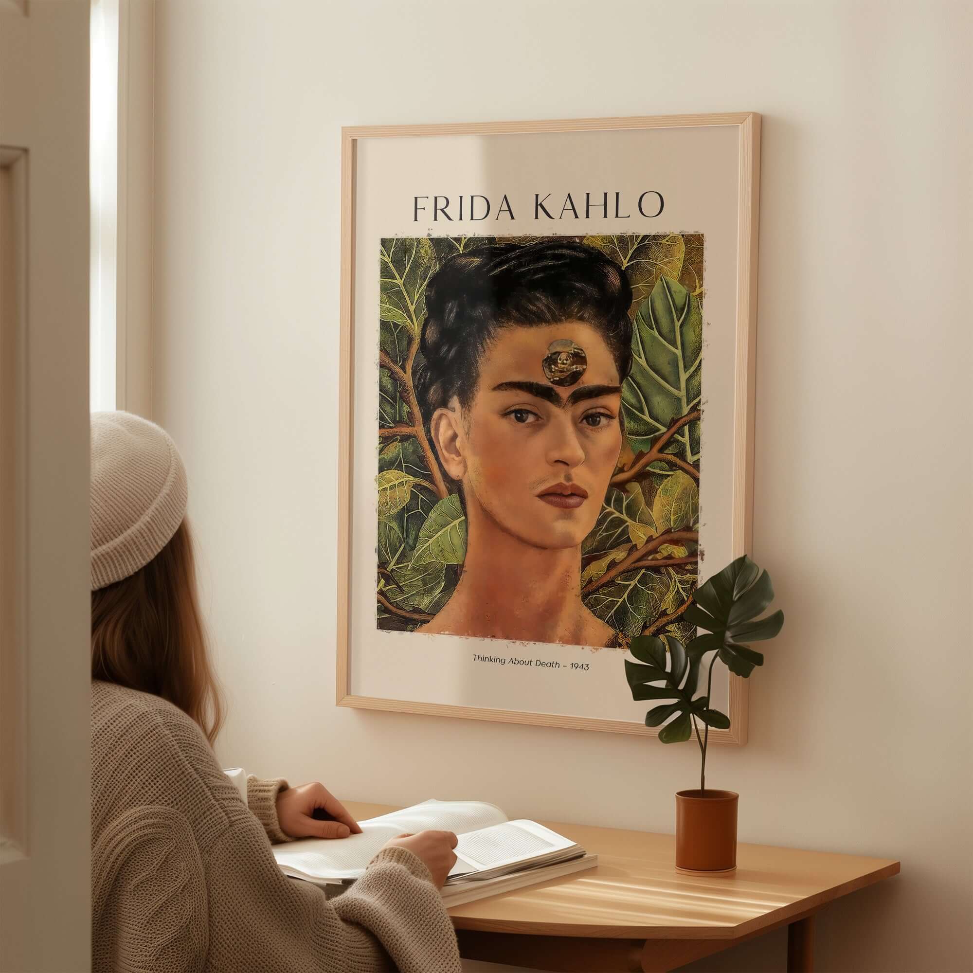 Frida Kahlo Thinking About Death Self Portrait Wall Art Print Poster displayed in a cozy setting with a person studying.