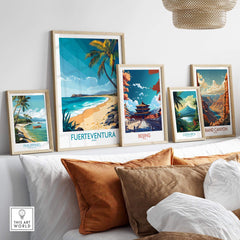 Fuerteventura Art Print displayed among travel posters on a stylish home decor shelf featuring tropical beach scenes.