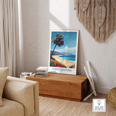 Fuerteventura Poster displayed in a cozy living room with tropical beach scene and palm tree.