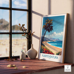 Fuerteventura Poster framed against a window overlooking a beach, showcasing tropical scenery and vibrant colors.