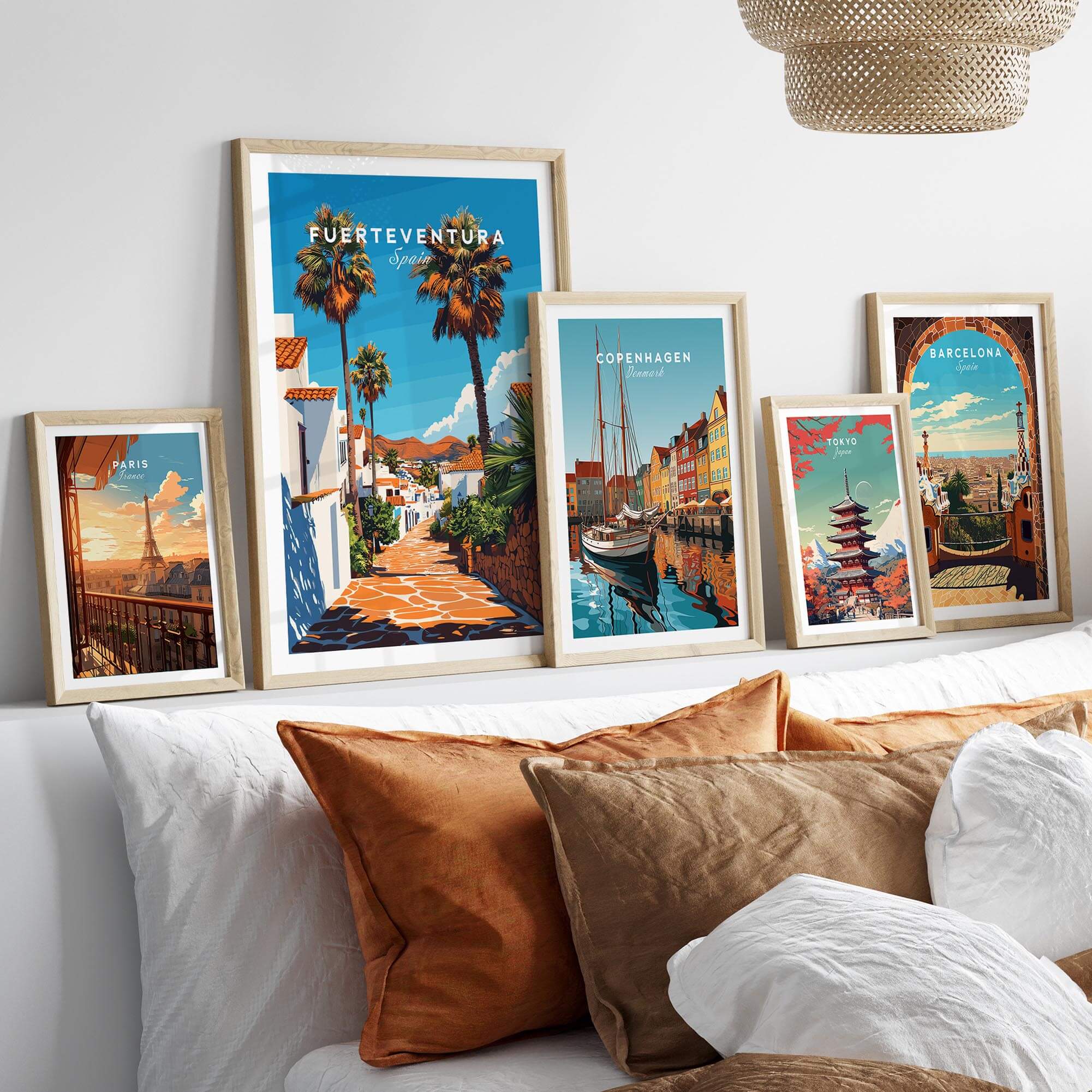 Fuerteventura Print Canary Islands Spain displayed among other travel art prints on a stylish bed.