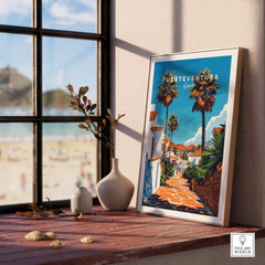 Fuerteventura Print Canary Islands Spain displayed on a windowsill with a beach view in the background.
