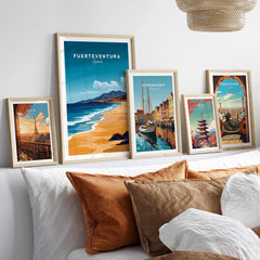 Fuerteventura Travel Print displayed among other travel wall art framing stunning beach views and vibrant cityscapes.