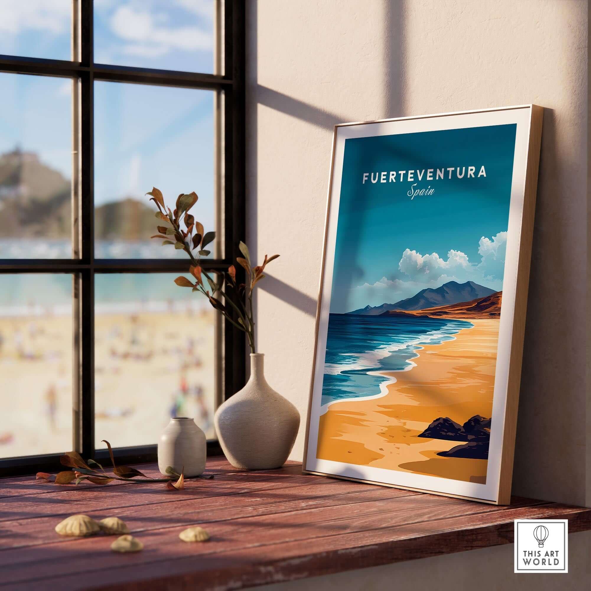 Fuerteventura Travel Print displayed in a bright room with a view of the beach, capturing Spain's vibrant coastline.