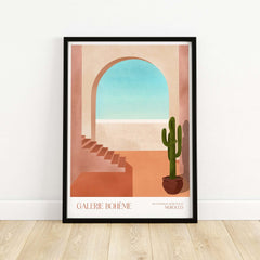 Galerie Bohème Moroccan Archway Cactus Art Print Terracotta Wall Decor Poster displayed in a modern frame on wooden floor.