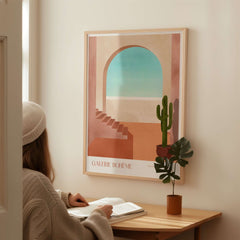 Galerie Bohème Moroccan Archway Cactus Art Print Terracotta Wall Decor Poster featured in a cozy interior setting.