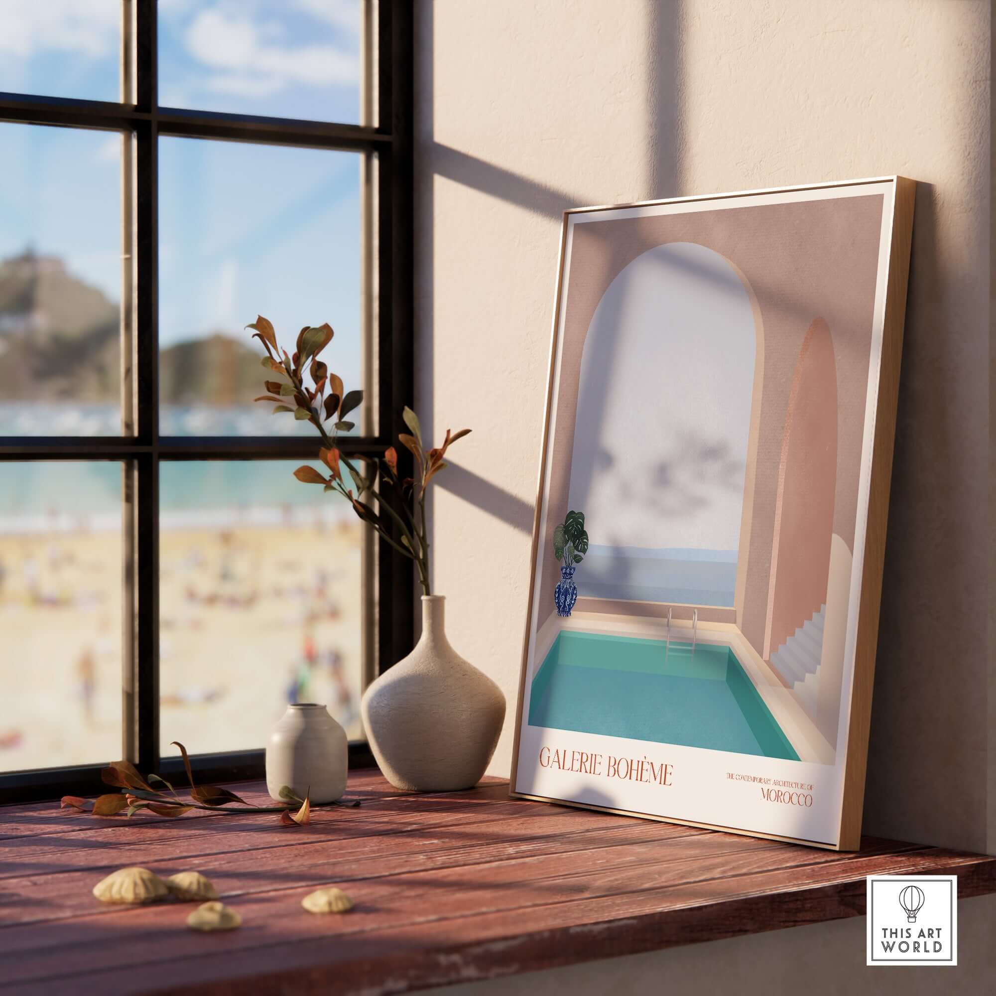 Galerie Bohème Moroccan Pool Ocean Archway Art Print Mediterranean Poster displayed in a sunlit room by a window.