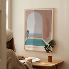 Galerie Bohème Moroccan Pool Ocean Archway Art Print Mediterranean Poster displayed on a wall in a cozy interior setting.