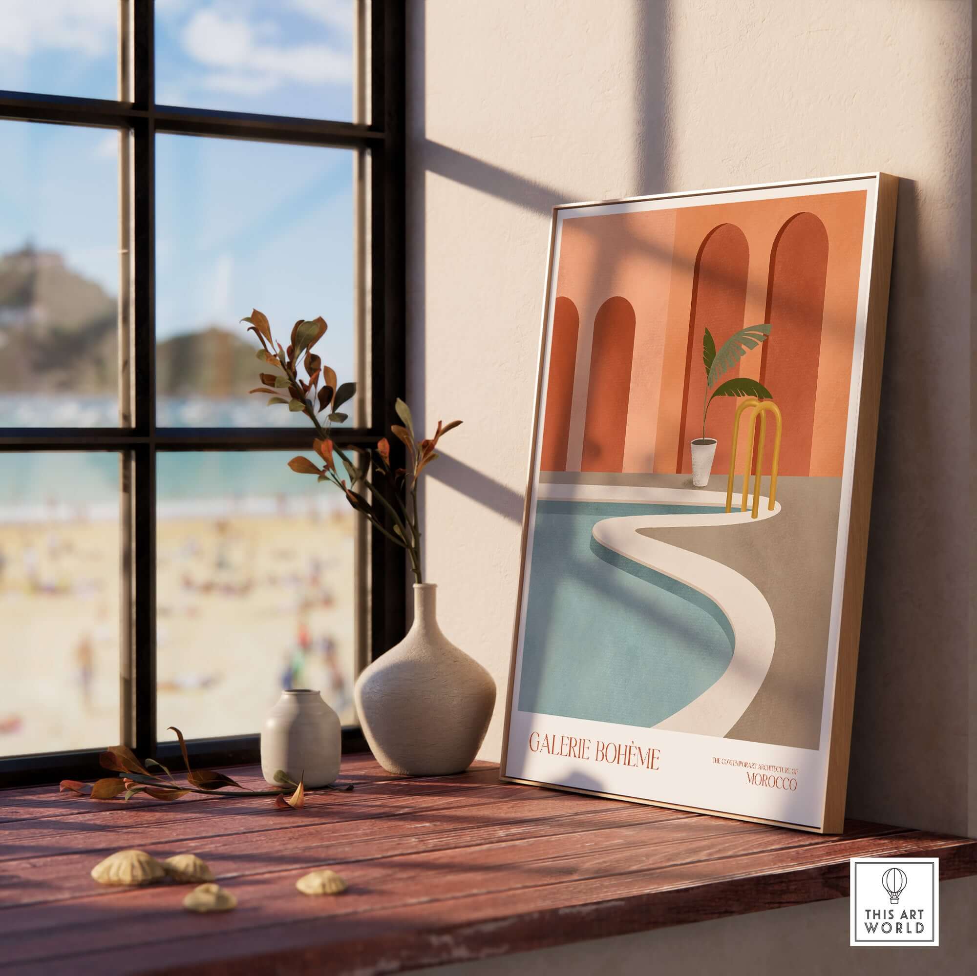 GALERIE BOHÈME Poolside Morocco Architecture Poster Minimalist Wall Art Print displayed on a windowsill with a beach view.