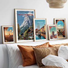 Garmisch-Partenkirchen Bavarian Alps View Print | Mountain Lodge Wall Decor framed with other city prints on a couch.