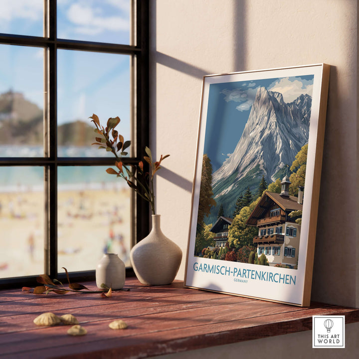 Garmisch-Partenkirchen Germany Mountain Town Art Print | Alpine Chalet Poster displayed by a sunny window.