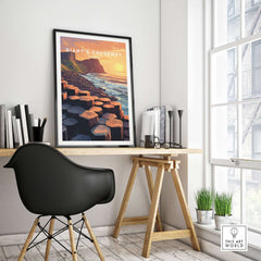 Giant's Causeway Wall Art Poster displayed in a modern office with a view and inspiring sunset colors.