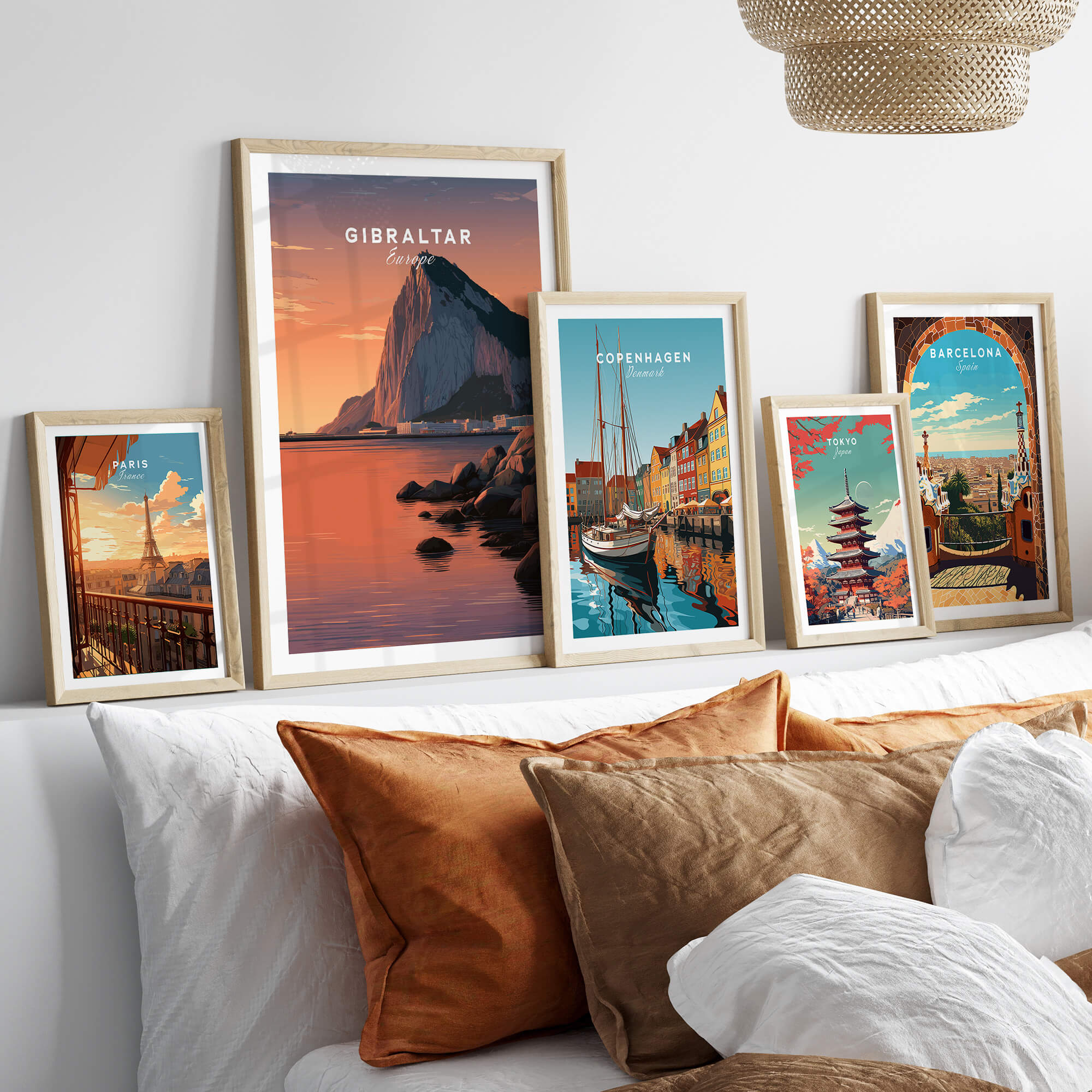 Gibraltar Travel Poster – The Rock of Gibraltar Sunset Cityscape Art displayed among travel posters on a cozy bed.