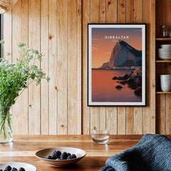 Gibraltar Travel Poster – The Rock of Gibraltar Sunset Cityscape Art displayed in a cozy interior setting.
