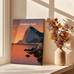 Gibraltar Travel Poster – The Rock of Gibraltar Sunset Cityscape Art displayed next to a vase of flowers.