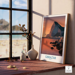 Gibraltar Wall Art –The Rock & Bay Landscape Print on display next to a window with a view of the beach.