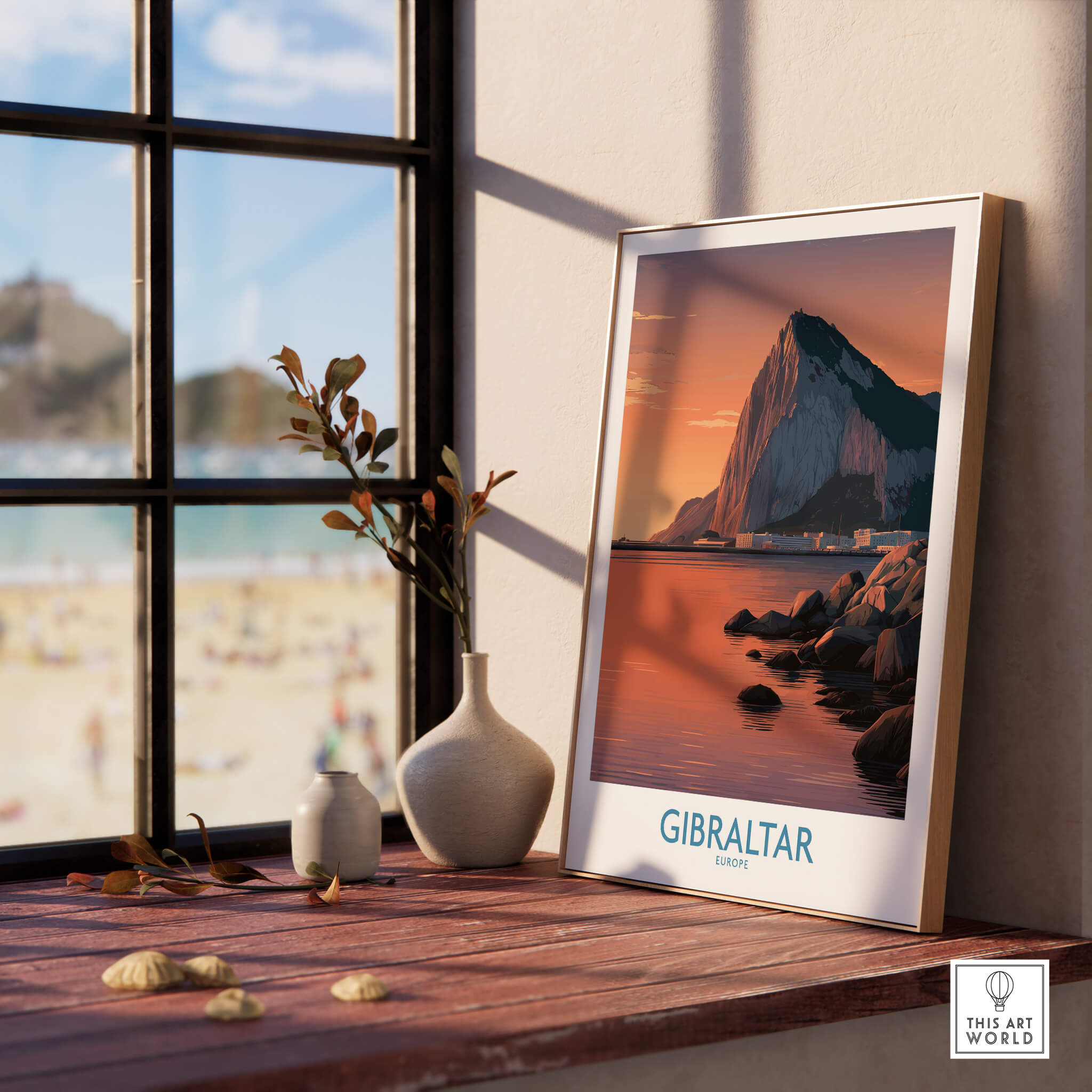 Gibraltar Wall Art –The Rock & Bay Landscape Print on display next to a window with a view of the beach.
