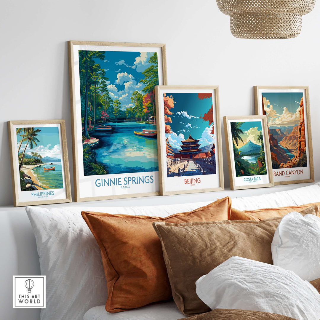 Ginnie Springs Florida Boats Art Print | Scenic River Travel Poster displayed among travel posters on a cozy sofa.