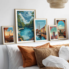Ginnie Springs Print | Vibrant Florida Wall Decor displayed with other travel prints on a cozy bed.