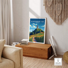 Glastonbury Tor Poster displayed in a stylish living room with natural decor and a wooden table.