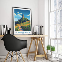 Glastonbury Tor Wall Art Print displayed in a modern interior setting with a stylish chair and bookshelf.