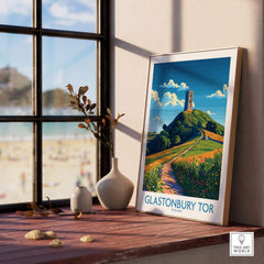Glastonbury Tor Wall Art Print displayed in a cozy interior with a view of the outdoors.
