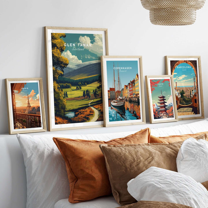 Framed Glen Tanar print alongside vibrant city posters, enhancing home decor with Scotland's scenic beauty.