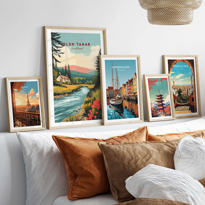 Glen Tanar Scotland poster displayed with other travel posters in a stylish home setting, showcasing vibrant landscapes and scenery.