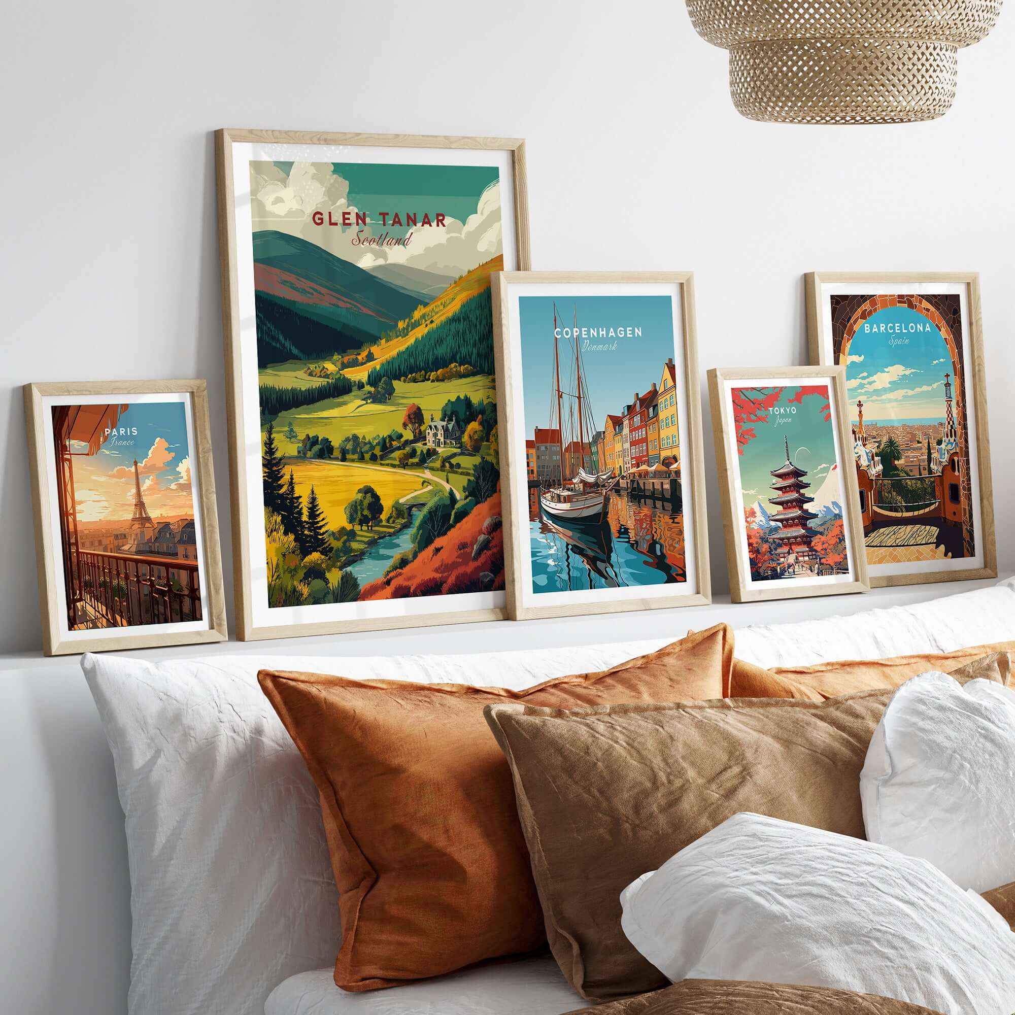 Glen Tanar Travel Print framed on a wall with other travel prints showcasing stunning landscapes and cityscapes.