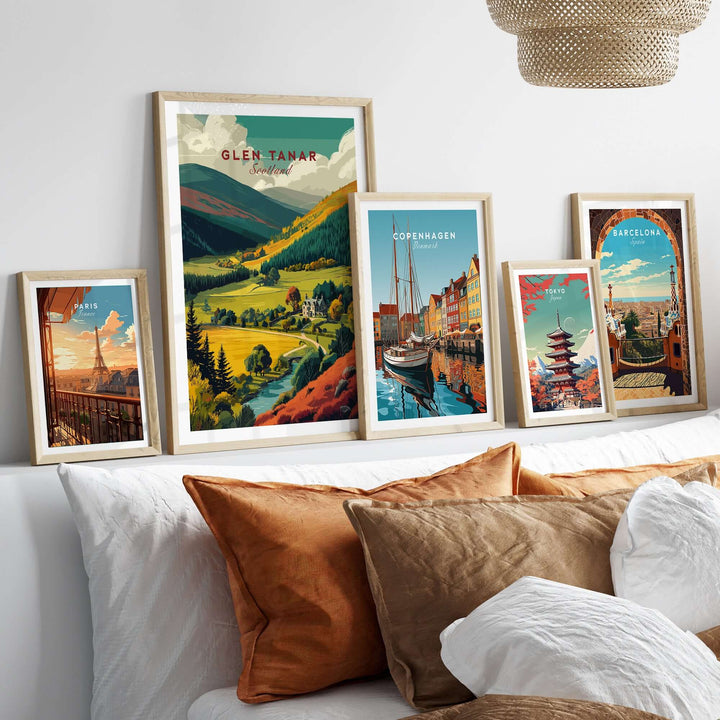 Framed Glen Tanar travel print showcasing Scottish Highlands landscape in a cozy home setting with other travel art.