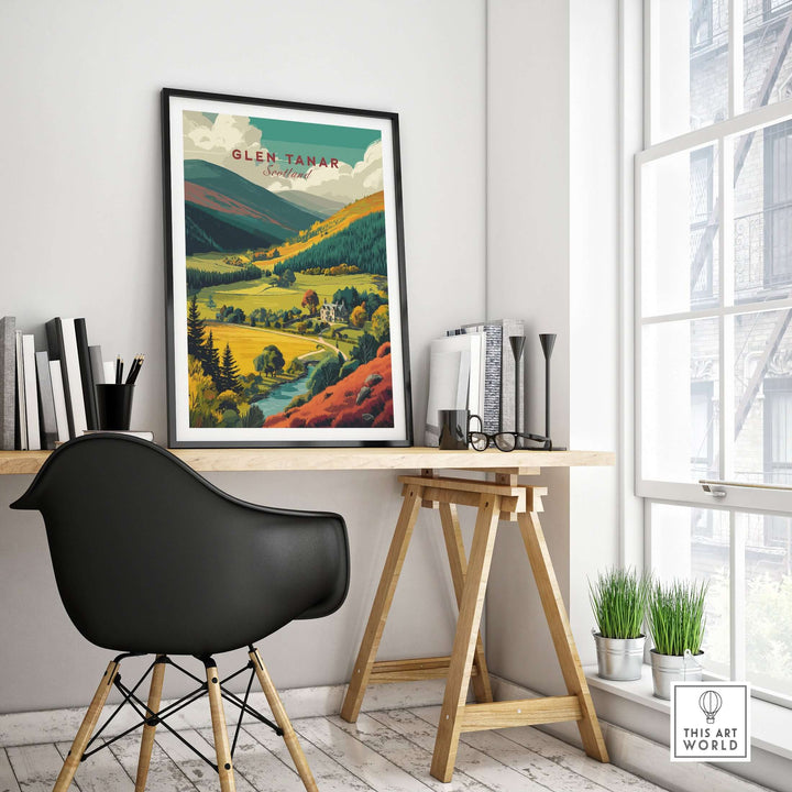 Glen Tanar travel print hanging in a modern workspace, showcasing scenic landscapes of the Scottish Highlands.