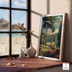 Glen Tanar Wall Art Print displayed on a wooden table by a window, showcasing a beautiful landscape of Glen Tanar.