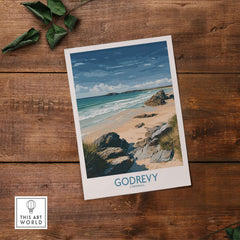 Godrevy Beach Poster - Cornwall Seascape Art Print - Coastal Travel Decor displayed on wooden surface with foliage.