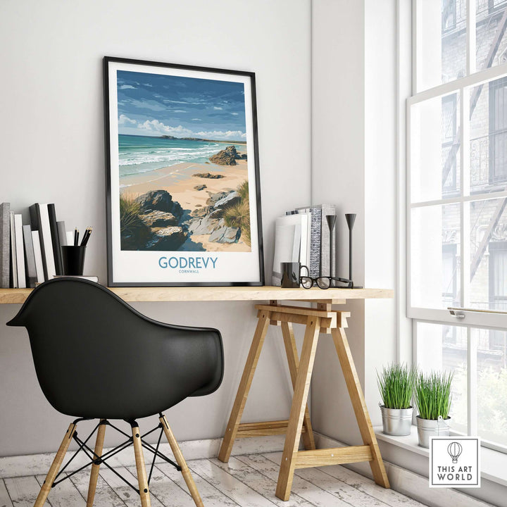 Godrevy Beach poster art print displayed in a modern workspace, showcasing Cornwall's coastal beauty.